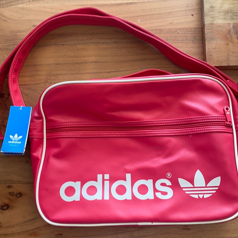 New Adidas sports bag pink and white. Purchased in Italy . Never used it .